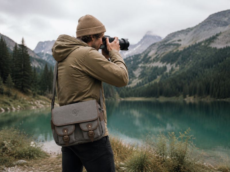 a-grey-camera-bag-carried-by-a-man