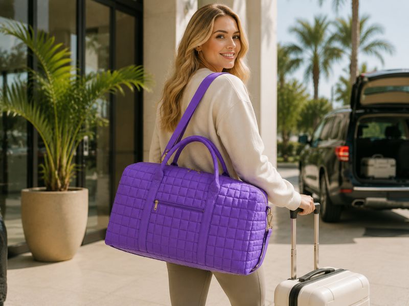 a-purple-quilted-duffle-bag-carried-by-a-woman