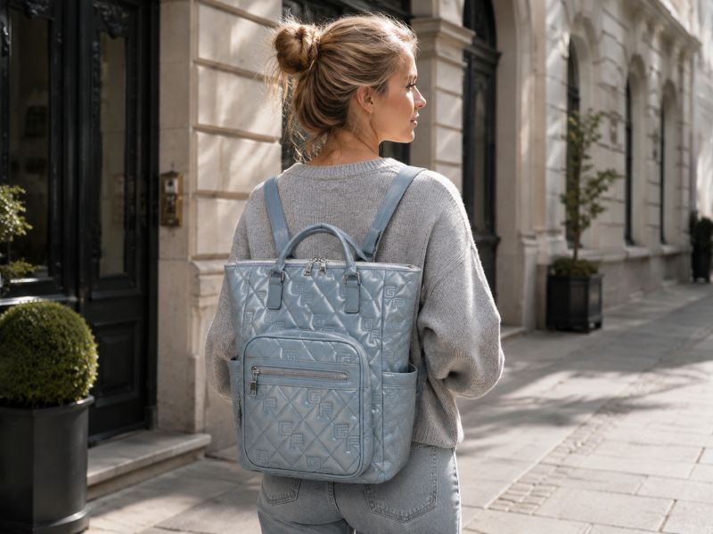 a-woman-carrying-a-baby-blue-tote-bag-backpack