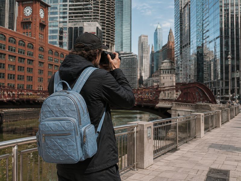 blue-camera-bag-carried-by-a-man