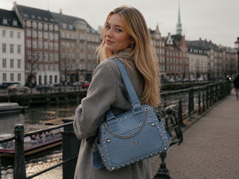 woman-with-light-blue-studded-bag